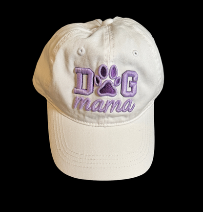White cap with 'DOG mama' text in purple on a black background