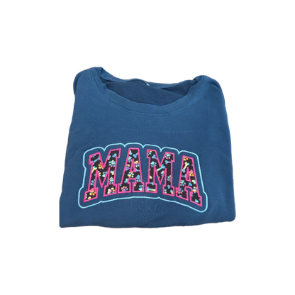 Folded navy blue sweatshirt with 'MAMA' print on a blue background