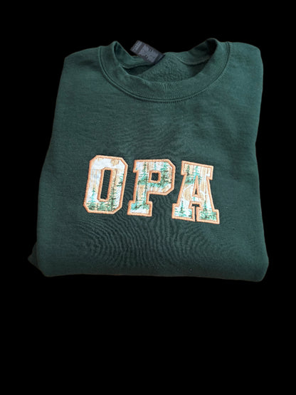 Green sweatshirt with 'OPA' text on a woven surface