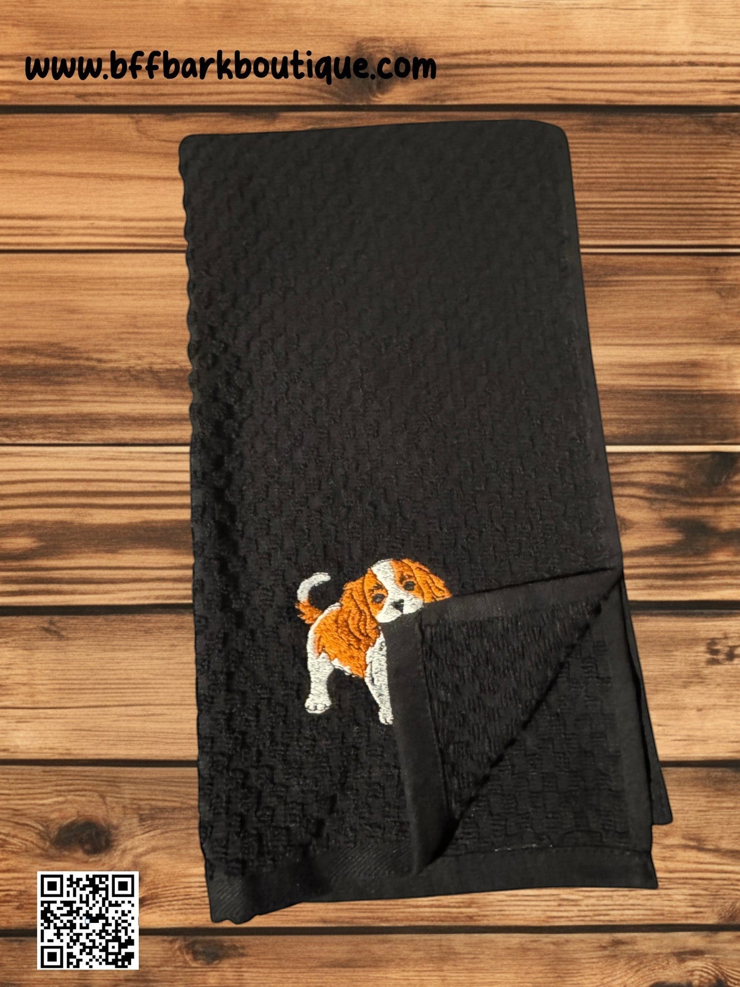 BFF Bark Boutique black waffle-weave cotton towel featuring an embroidered Cavalier King Charles Spaniel puppy.